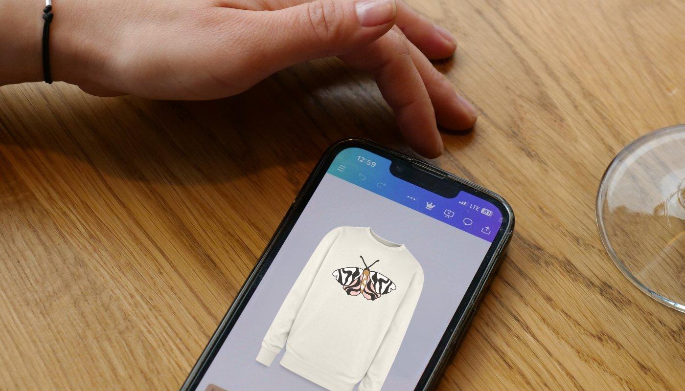 mockup of a moth design on sweatshirt using canva design tool